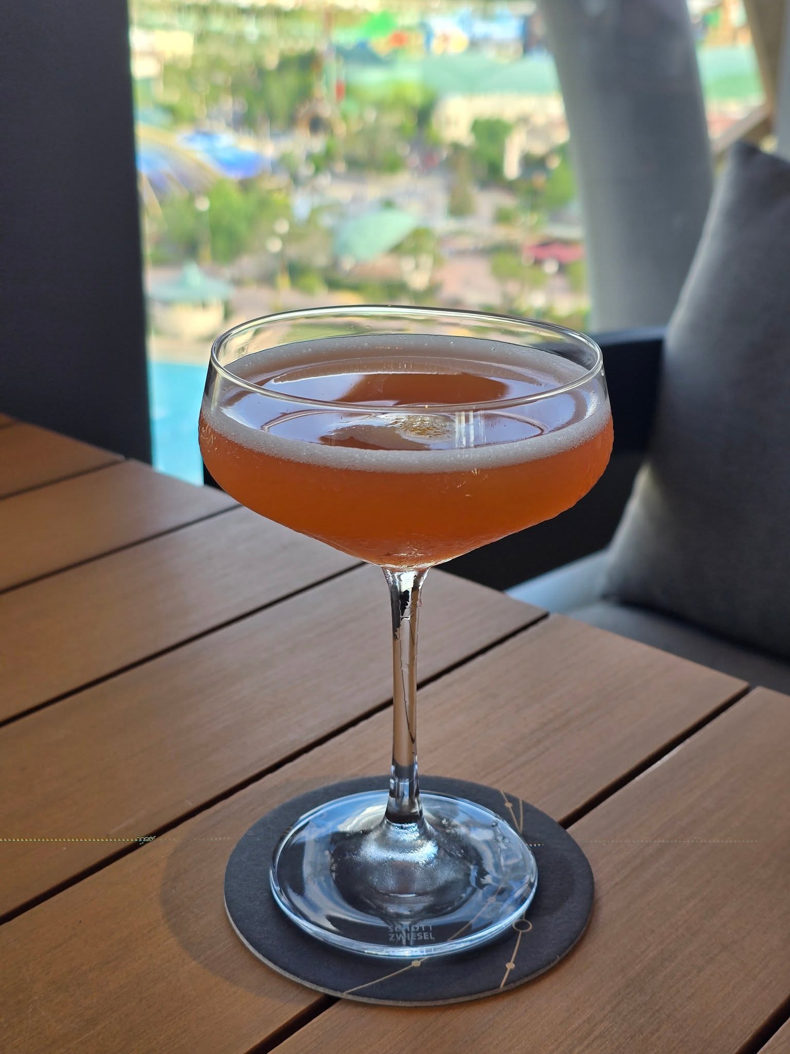 Bar Helios rooftop cocktail with Epic Universe view